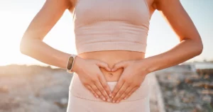 Woman showing heart shape on her abdomen for intimate health in Erie, PA